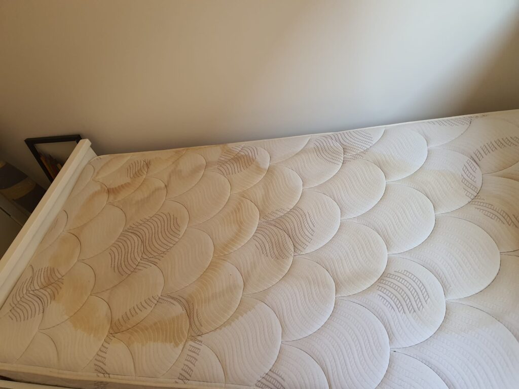 Before: Pillow-top mattress stains
