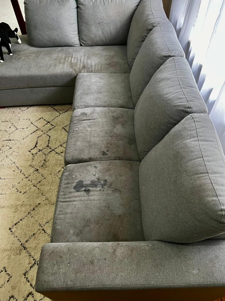 Before: Stained modular fabric sofa