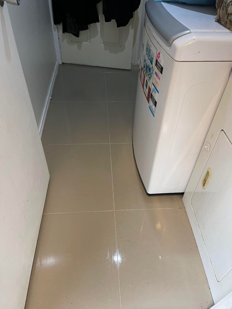 After: Laundry tiles and grout restored